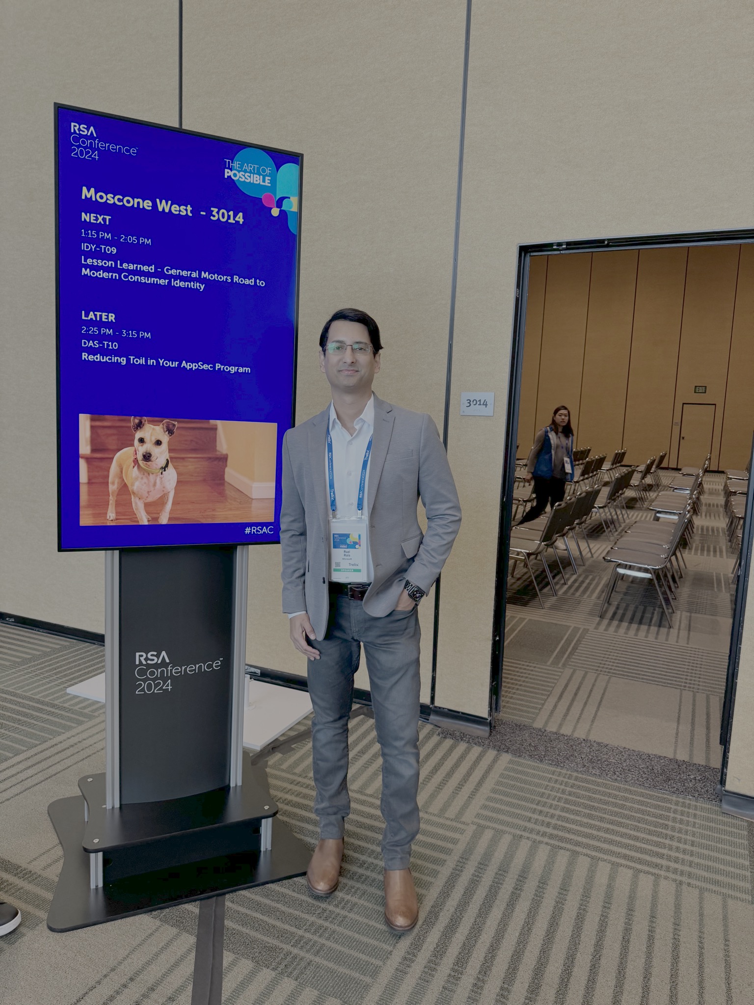 Razi Rais next to RSA Conference 2024 session signage outside Moscone West 3014, with the IDY-T09 talk title on screen